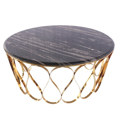 Ronde tafel van roestvrij staal met een oppervlak van marmeren glas